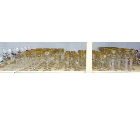 A part suite of Continental glasses, 20th century, each with gilt foliate and coloured jewelled decoration, together with fiv
