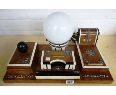 An Art Deco rosewood and ivory strung desk compendium with silver foliate mounts, comprising; a table light with opaque globu