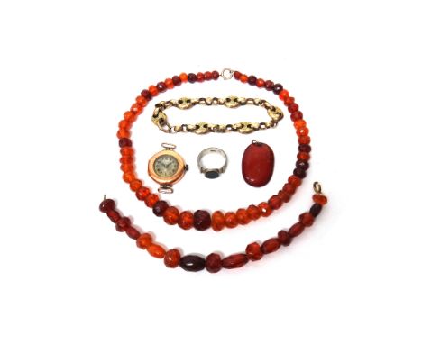 A Victorian gold cased, faceted circular and anchor link bracelet, a reconstituted amber bead necklace, with a similar bracel