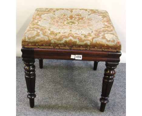 A William IV rosewood square footstool with tapestry upholstered seat, on turned tapering stylised lappet supports, 47cm wide