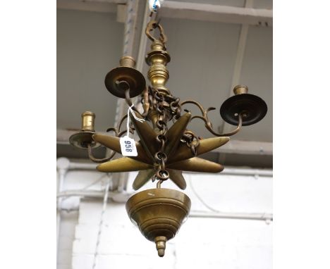 A Jewish brass four branch Sabbath lamp, 19th century, with baluster central turned column issuing four scroll branches, with