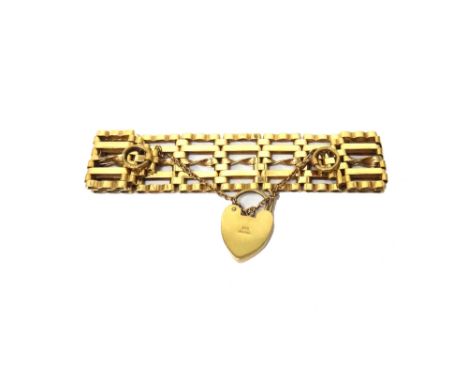 A 9ct gold bar, twisted bar and oval link gate bracelet, on a 9ct gold heart shaped padlock clasp, weight 26 gms.