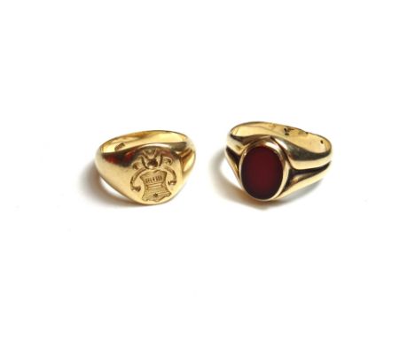 A gold signet ring, shield engraved, detailed 18 CT, ring size P and a half, weight 10 gms and a gold and cornelian set signe