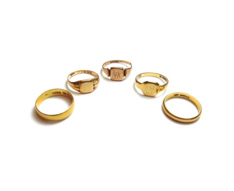 Two 22ct gold wedding rings, combined weight 7.2 gms, two 18ct gold signet rings, combined weight 6.1 gms and a 9ct gold sign