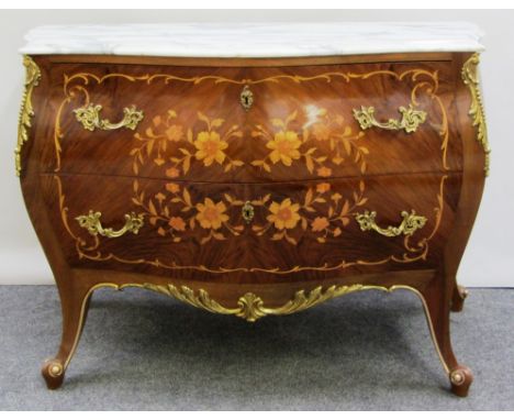 A Louis XV style gilt metal mounted marquetry inlaid walnut commode, the serpentine marble top over a bombe two drawer base, 