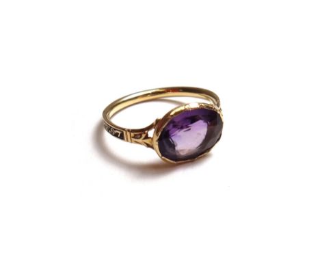 A gold and amethyst set mourning ring, collet set with an oval cut amethyst, the black enamelled band detailed RICHD;
GOSSIE.