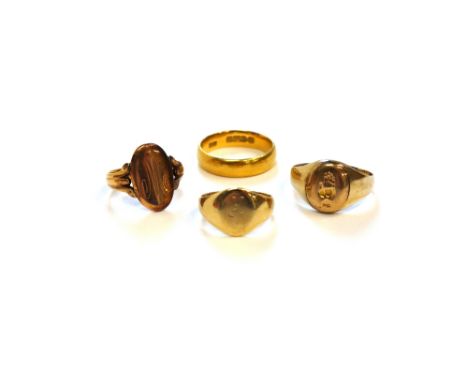 A 9ct gold oval signet ring, two further gold signet rings, combined weight 8.6 gms and a 22ct gold plain wedding ring, Chest