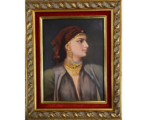 A Vienna portrait plaque dated 1862, painted with a half length portrait of an Eastern lady in profile wearing elaborate gold