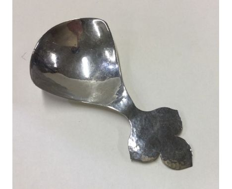 A large silver caddy spoon with leaf decoration. London. By CS. Approx. 31 grams. Est. £40 - £50.