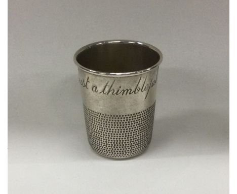 A novelty American silver cup inscribed, 'Just a Thimbleful', with beaded decoration. Marked Sterling. Approx. 32 grams. Est.