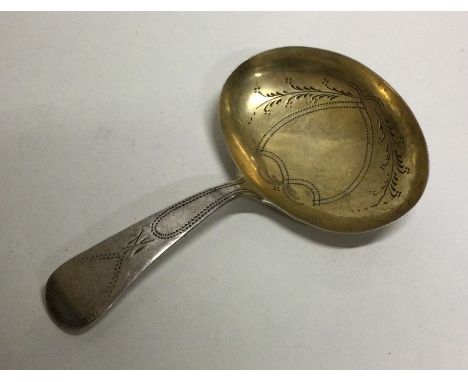 A silver caddy spoon with gilt bowl. Birmingham 1799. By IT. Approx. 7 grams. Est. £40 - £60.