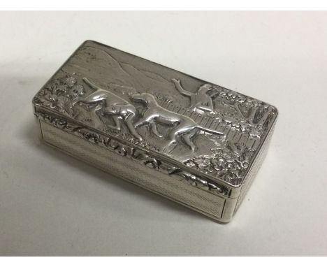A George III silver snuff box chased with dog hunting scene. Birmingham 1830. By Thomas Shaw. Approx. 77 grams. Est. £400 - £