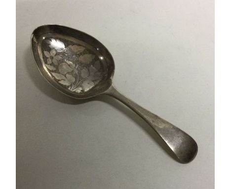 A silver OE pattern caddy spoon with engraved decoration. Birmingham 1819. By IT. Approx. 12 grams. Est. £40 - £60.