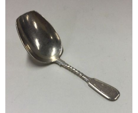 A Russian silver bright cut caddy spoon. Approx. 20 grams. Est. £50 - £80.