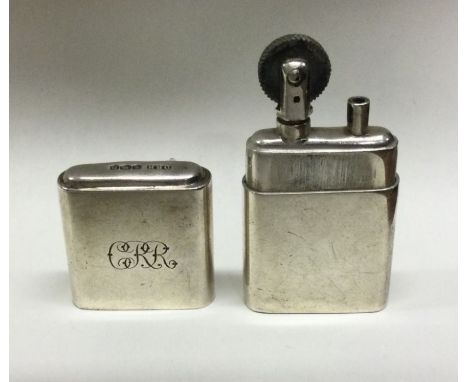 A silver lighter. Sheffield 1946. By Dudley Russell Howitt. Approx. 65 grams. Est. £100 - £150.