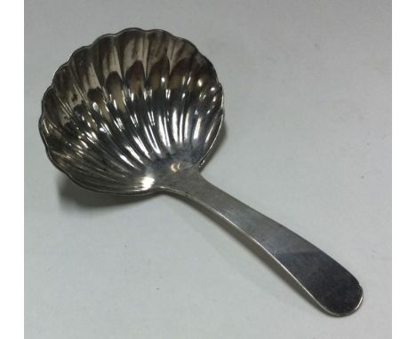 A large George III silver caddy spoon. London 1816. By HN. Approx. 13 grams. Est. £35 - £45.