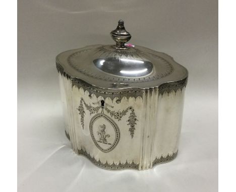 A Georgian silver tea caddy with engraved bright cut decoration. London 1788. By William Plummer. Approx. 455 grams. Est. £15