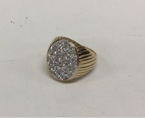 A large gold ring with stone mount. Approx. 8.9 grams. Est. £120 - £150.