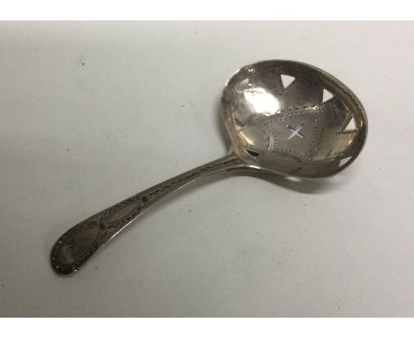 A George III silver caddy spoon with engraved and pierced decoration. London 1793. By George Barrows. Approx. 9 grams. Est. £