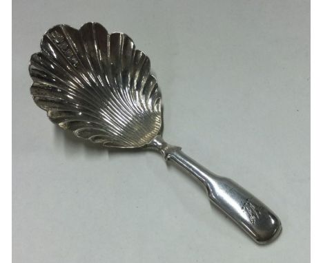 A George III fluted silver caddy spoon. Birmingham. By John Taylor. Approx. 8 grams. Est. £45 - £55.