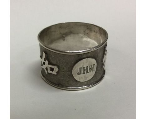 A Chinese export silver napkin ring chased with Chinese characters. Approx. 29 grams. Est. £25 - £35.