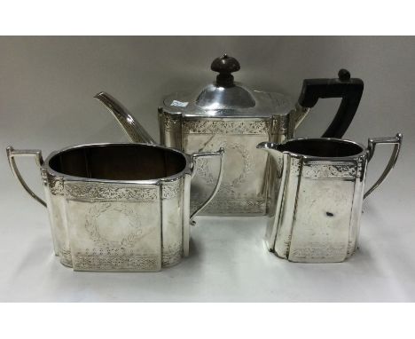 A good engraved bachelor's silver tea service. London 1882. By Martin Hall. Approx. 679 grams. Est. £400 - £500.