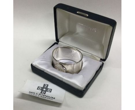 A cased silver Millennium napkin ring. London. Approx. 16 grams. Est. £15 - £20.
