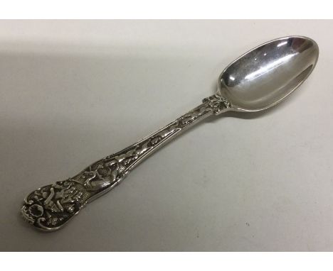 OF HUNTING INTEREST: A rare Victorian silver spoon chased with dogs and a huntsman decoration. London 1851. By George Angel. 