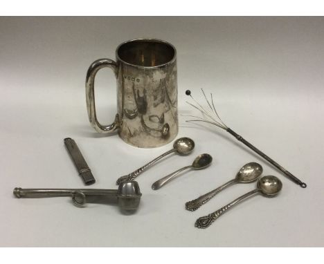 A silver christening cup together with a swizzle stick etc. Approx. 125 grams. Est. £30 - £50.