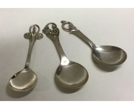 Three Danish silver caddy spoons. Approx. 18 grams. Est. £30 - £50.