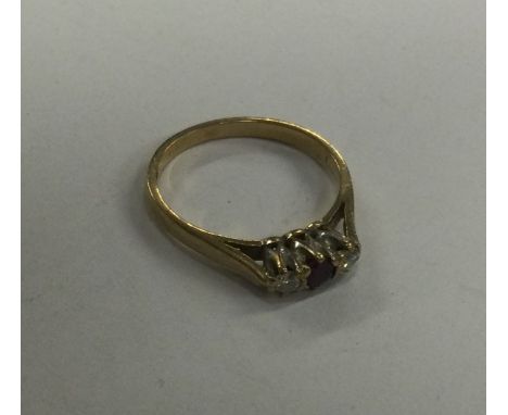 A small 9 carat ruby and diamond cluster ring. Approx. 1.9 grams. Est. £30 - £40.