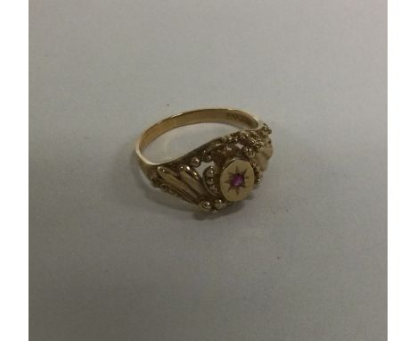 A ruby mounted gypsy set ring. Approx. 3 grams. Est. 330 - £40.