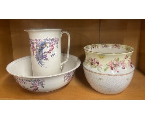 An Edwardian wash jug and bowl and a large planter.