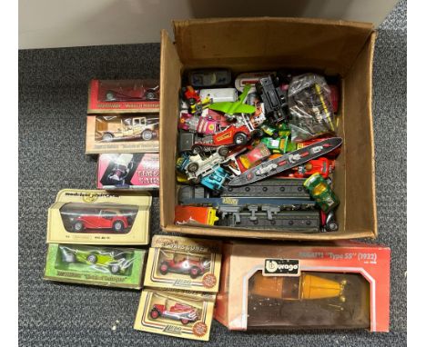 A quantity of boxed dye cast model cars.