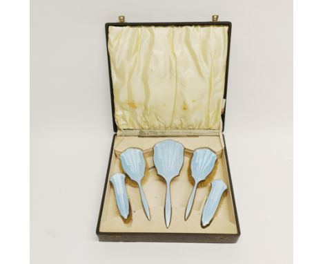 A boxed Art Deco enamelled dressing table set.