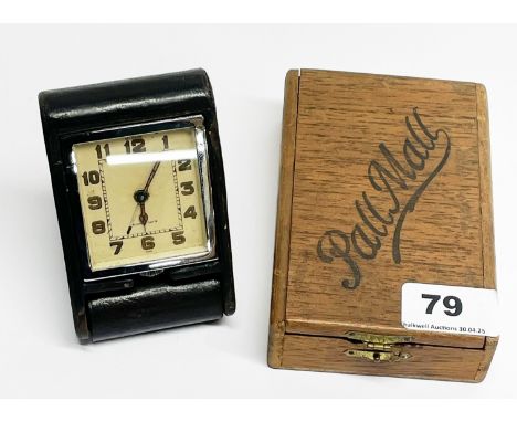A boxed 1930's Le Coultre folding alarm clock.