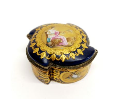 A 19thC French porcelain casket and contents, W. 9.5cm.