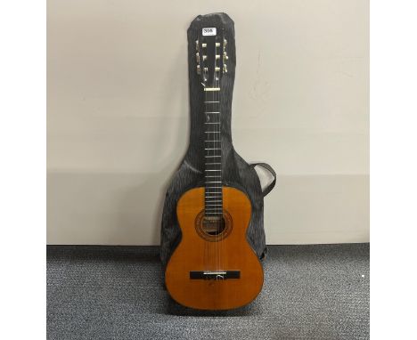 A Suzuki acoustic guitar.