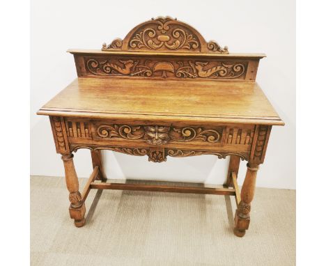 A single drawer carved oak console table, 110 x 107 x 48cm. Prov. Little Wakering Hall.
