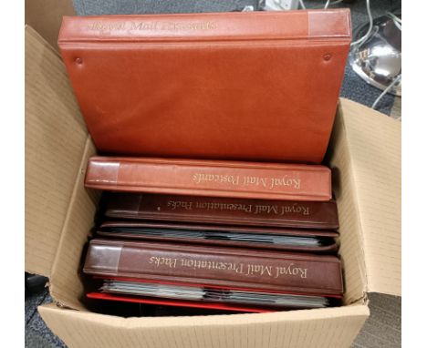 Eight albums of mixed first day cover stamps and postcards.