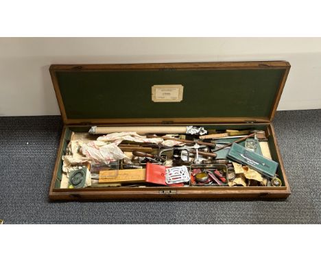 An antique case of fretworking tools.