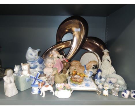 A selection of mainly modern decorative ornaments including delftware