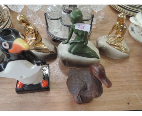 A selection of advertising items including part guiness penguin light and Carlsberg lady on rock