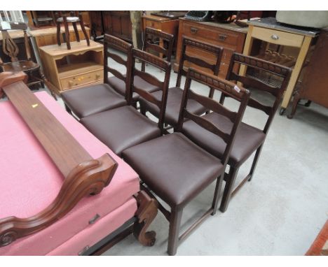 A set of 6 mid to late 20th Century ladder back dining chairs , having brown leather upholstered seats, possibly Ercol or Pri