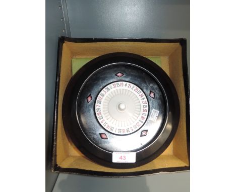 An early 20th century bakelite roulette wheel by K and C London