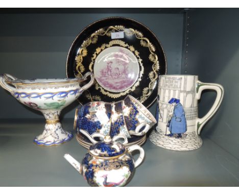 Three Booths cabinet cups and saucers in The Worcester Scale pattern, a matching miniature teapot, a Royal Doulton tankard, a