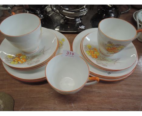 A Shelley part tea service having orange/yellow floral pattern decoration