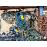 Lot of extension cords, paint hose, air hose, extension cords, pressure washing wands as pictured