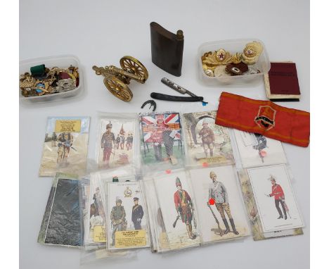 A Selection of vintage military postcards, Russian cap badges, flask and cut throat razor etc 