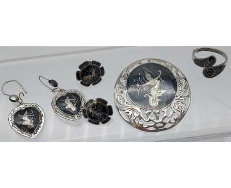 A Siam Sterling silver matching brooch, ring and two pairs of earrings. 